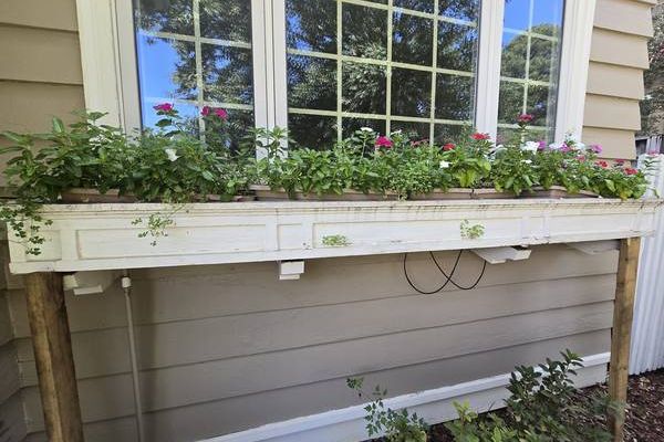 Window flower box area before repair in Little Rock