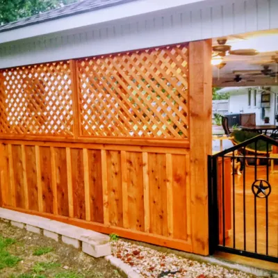 Cedar privacy fence with lattice patio cover built in Roland Arkansas