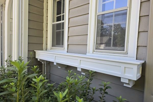 Window flower box rebuilt with new siding repair in Arkansas