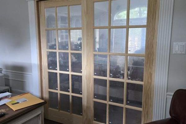 Custom bi-pass doors installed in cased opening Little Rock