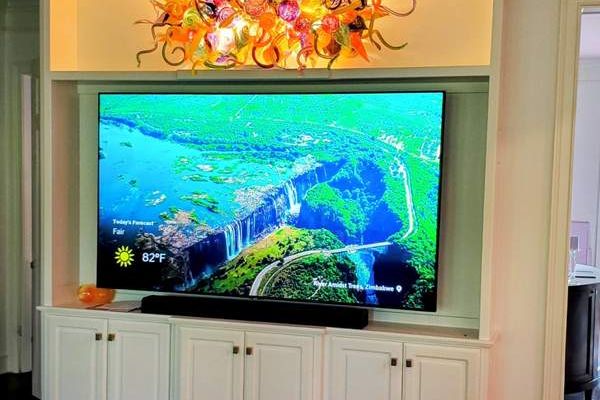 Bookcase converted to custom entertainment center in Little Rock